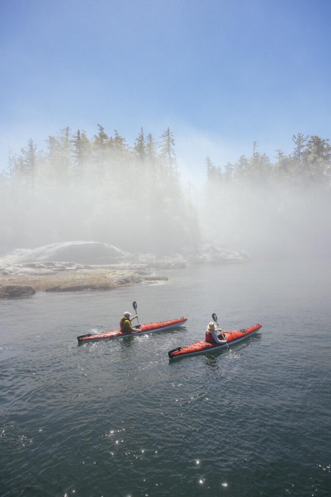 Kayaks in the mist | Luxury Nimmo Bay
